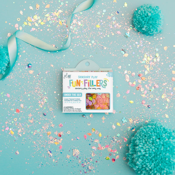 Créez un monde magique avec les Fun Fillers Ocean ! Accessoires sensoriels scintillants pour jeux d’éveil, pâte à modeler, eau, riz ou slime. Dès 3 ans.