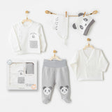 Coffret bébé 5 pièces en coton 100% pour la sortie de maternité. Inclut bavoir, bonnet, pantalon, brassière et gilet assorti, pour un accueil tout en douceur dès la naissance.