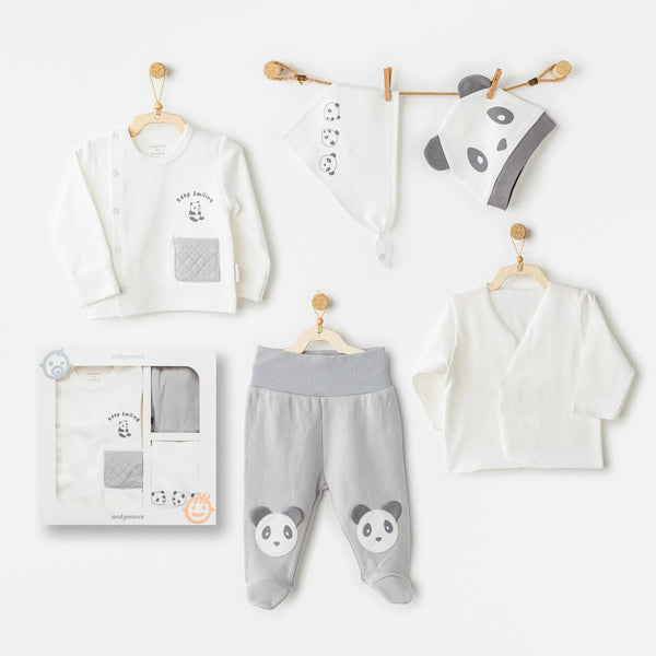 Coffret bébé 5 pièces en coton 100% pour la sortie de maternité. Inclut bavoir, bonnet, pantalon, brassière et gilet assorti, pour un accueil tout en douceur dès la naissance.
