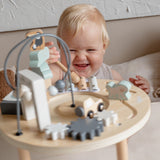 Table d’activité bébé en bois dès 18 mois. Jouet d’éveil complet pour développer motricité et coordination.