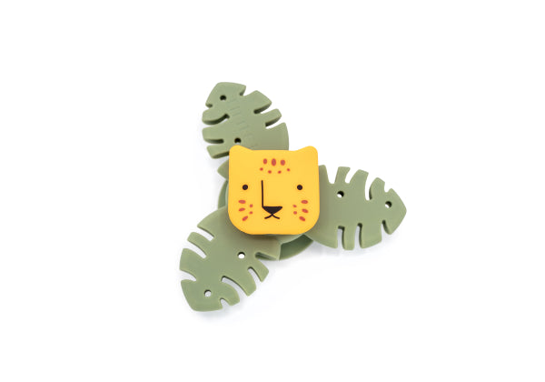 Tiger Spinner bébé : petit jouet sensoriel en silicone avec ventouse. Stimule motricité fine et sens dès la naissance pour éveil ludique.