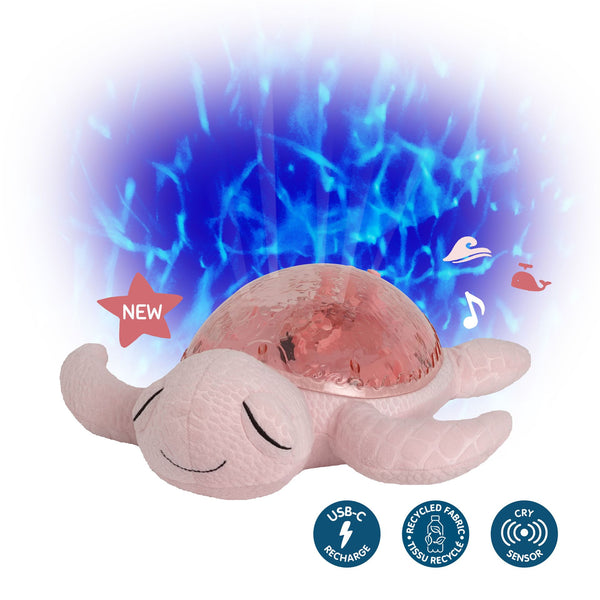 Veilleuse bébé Tranquil Turtle™ rose rechargeable : projections océaniques, bruits blancs, capteur de pleurs et minuterie. Idéale dès la naissance et parfaite en cadeau de naissance.