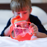 Jarre sensorielle Glo Pals corail | Jouet lumineux dès 18 mois