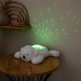 Veilleuse peluche ours polaire avec projection d’étoiles et sons apaisants. Timer 20 min, lumière douce et câline pour endormir bébé facilement.