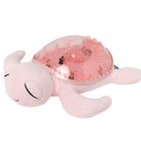Veilleuse bébé Tranquil Turtle™ rose rechargeable : projections océaniques, bruits blancs, capteur de pleurs et minuterie. Idéale dès la naissance et parfaite en cadeau de naissance.